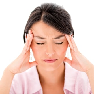 Woman with a headache - isolated over a white background